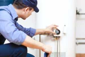 plumbing technician repairs water heater