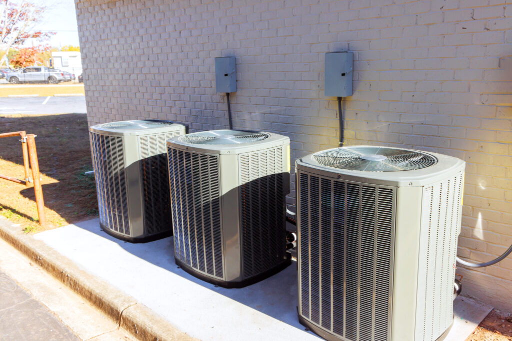 An outdoor air conditioning units has been installed on exterior facade of new a house