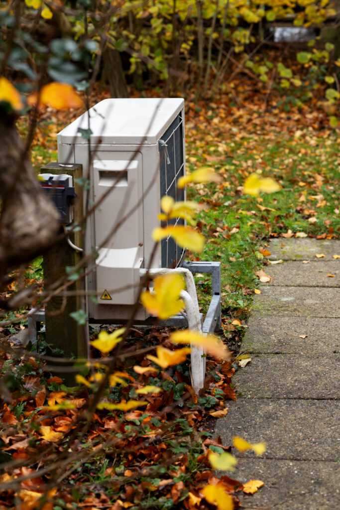 outdoor HVAC unit in autumn